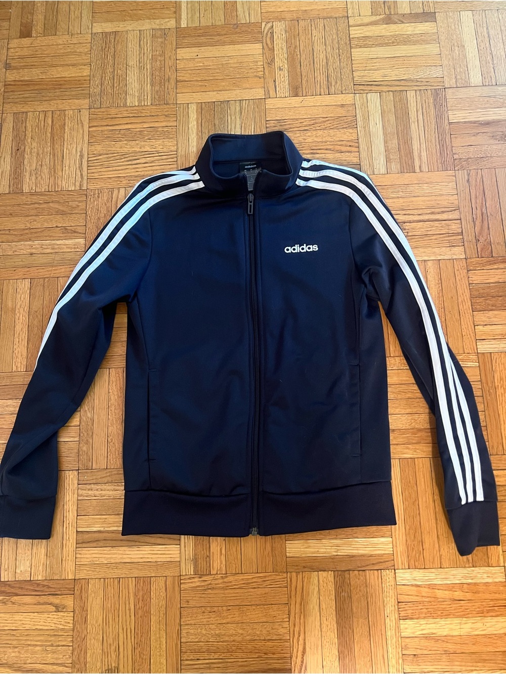 Soccer Core in this adidas Navy Blue Track Jacket with White Stripes